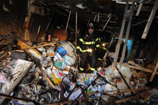 Todd Maisel's photo of firefighters in a burned out Brownstone in Bedford-Stuyvesant.